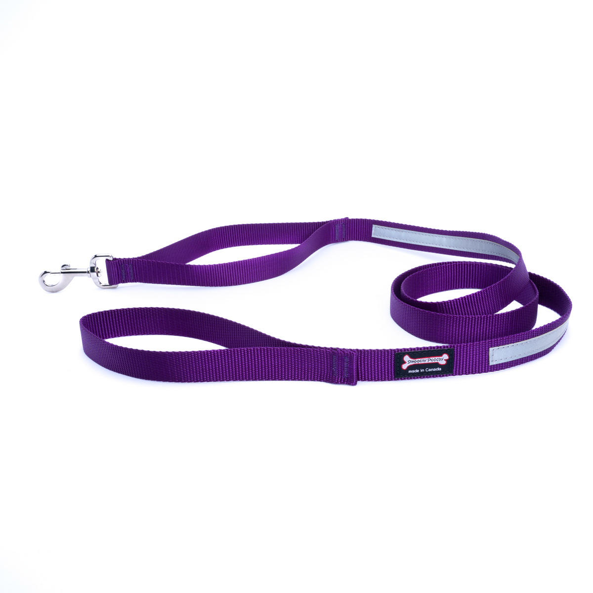 Purple nylon dog leash coiled on a white background with a reflective safety strip, silver clasp