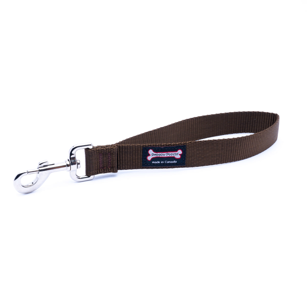 A brown nylon dog leash with a silver metal snap hook clasp