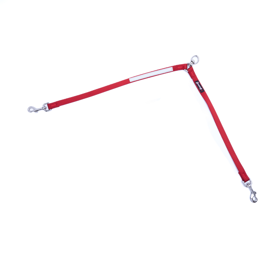 Red two-dog leash splitter on a white background, with a reflective safety strip, two clasps for two dogs, and a single ring connector