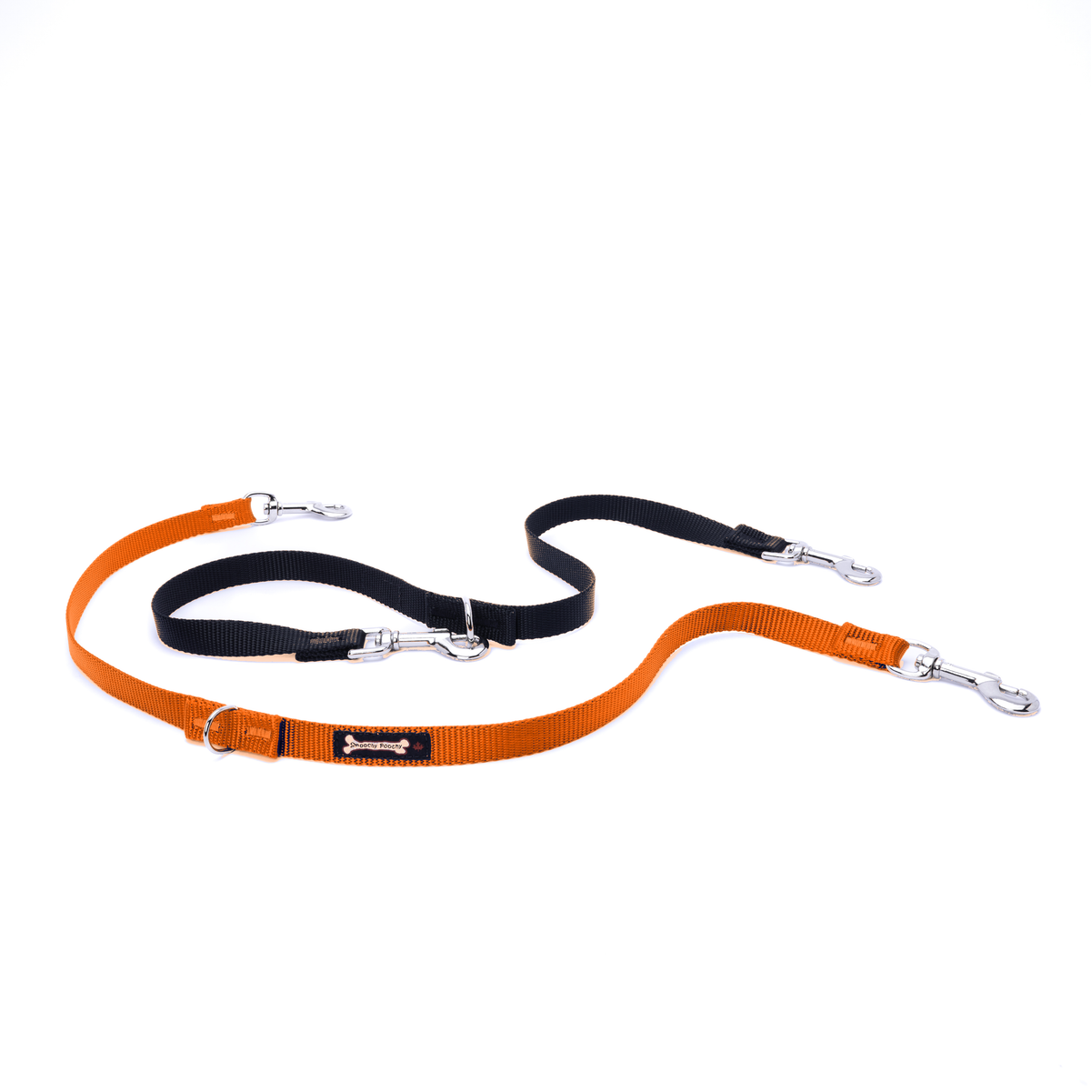 Orange and black multi-function dog leash on a white background, with silver clasps and D-rings at each adjustable point, plus a 'Smoochy Poochy' fabric tag on the teal strap.